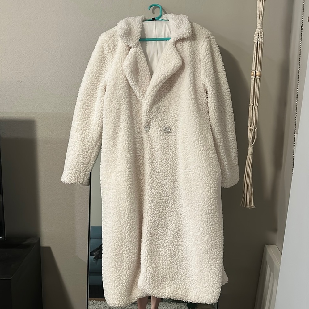 Maxi length white fur coat with rhinestone buttons